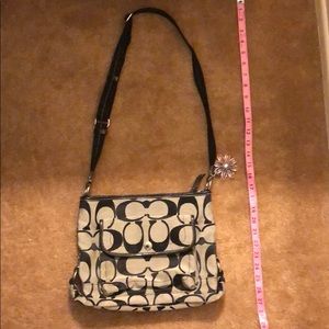 Black and gray Coach purse